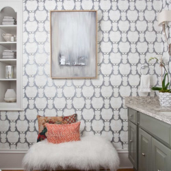 Elegant bathroom design with custom wallpaper and decorative pillows